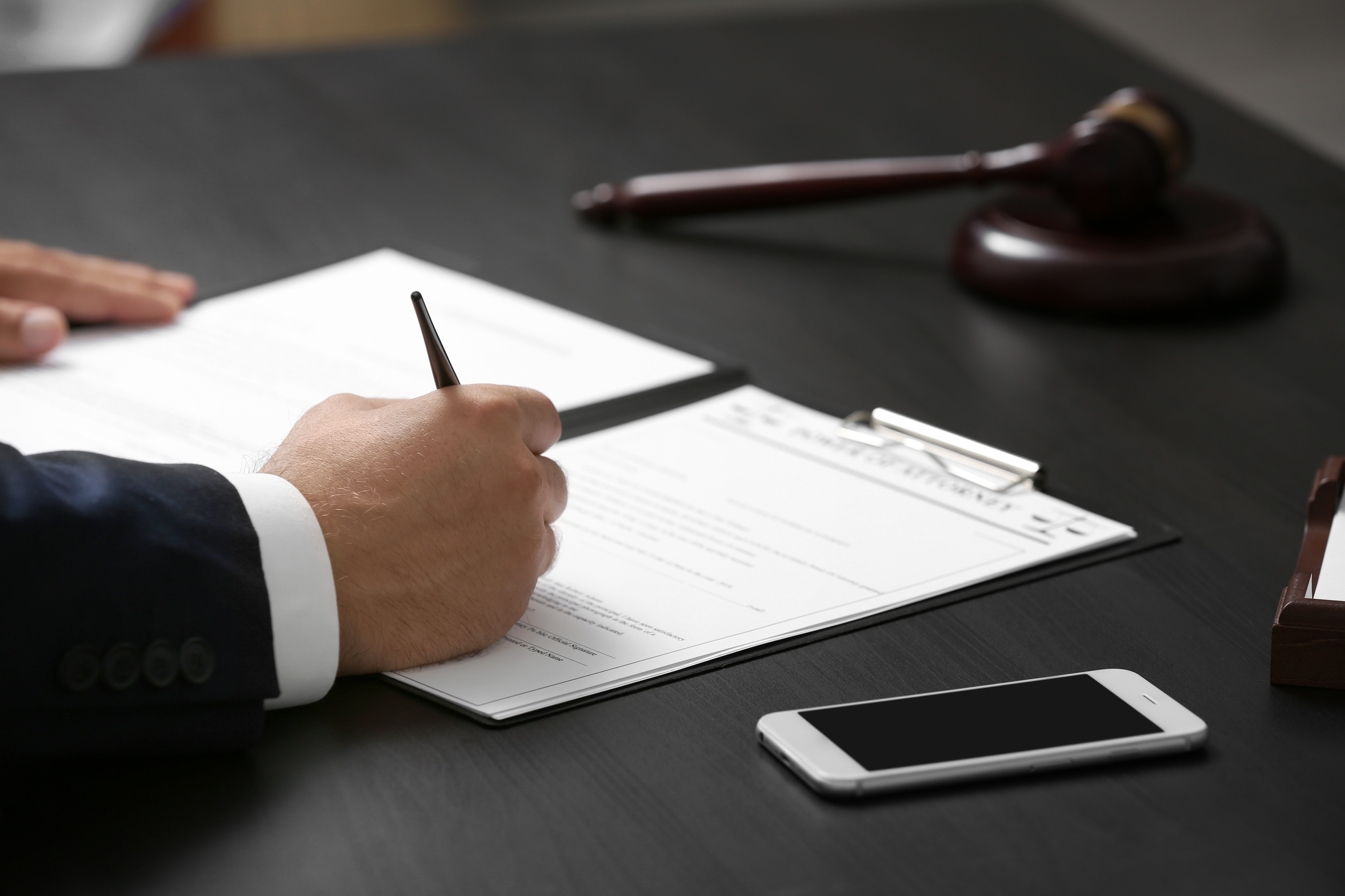 Man Signing Power Of Attorney